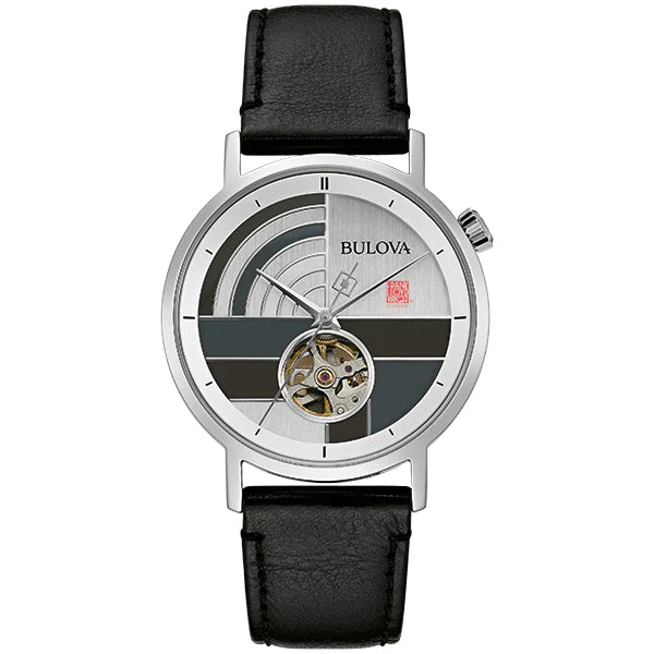 Bulova Frank Lloyd Wright 'December Gifts' Stainless Steel 3-Hand Automatic Watch featuring a silver-tone stainless steel case, black leather strap, and a gray patterned dial with silver accents and an open aperture showcasing the automatic movement. The watch also has a glass exhibition case back, revealing the intricate mechanics, and is water-resistant up to 30 meters.
